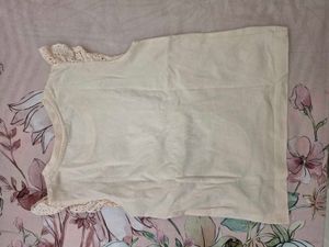 Top with attached denim slig bag