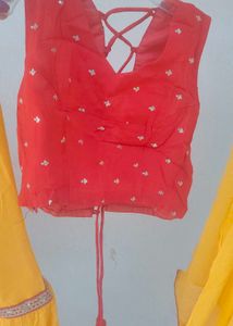 Vibrant Yellow Flared sharara and red choli duppat