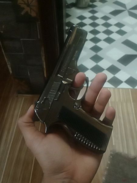 Gun In Hand Real