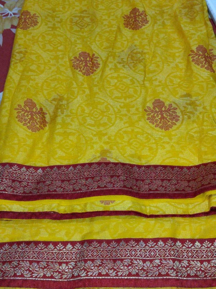 Vibrant Yellow Saree with Red Border