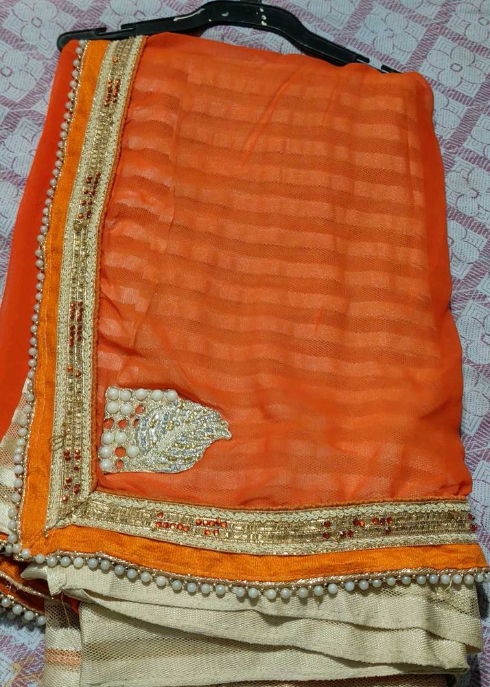 Elegant Orange Saree with Embellished Border