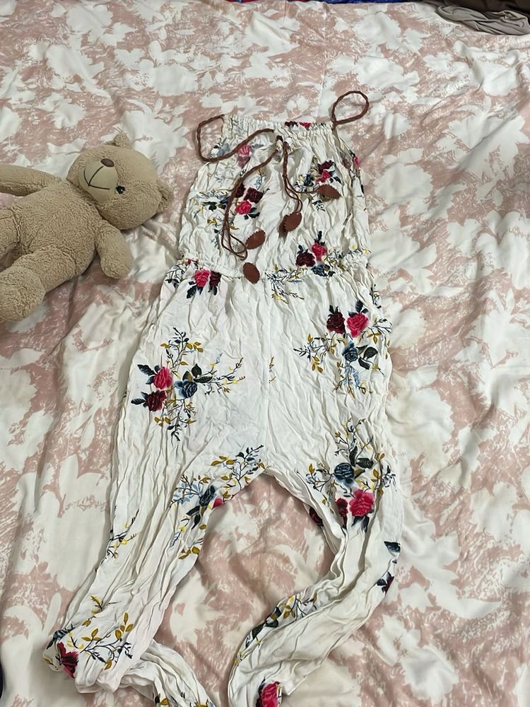 off white jumpsuit with floral touch