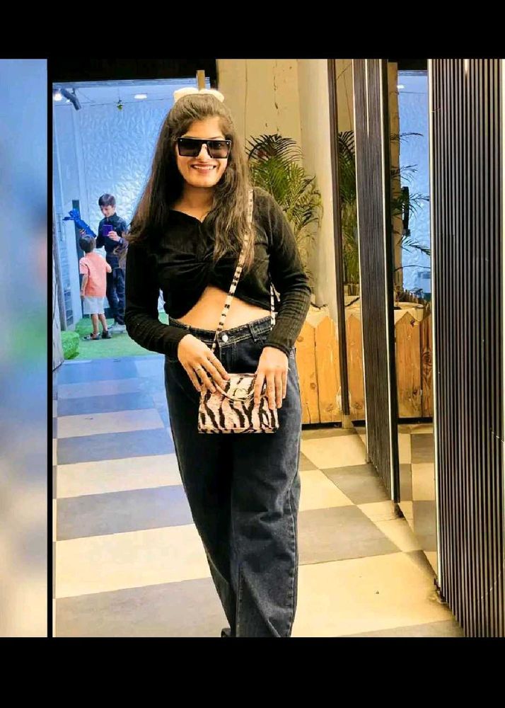 Stylish Black Cropped Top with denim jeans