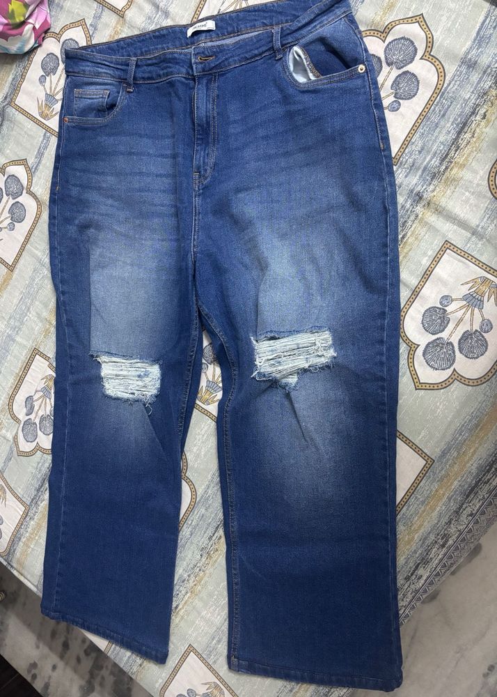 Distressed Blue Denim Jeans