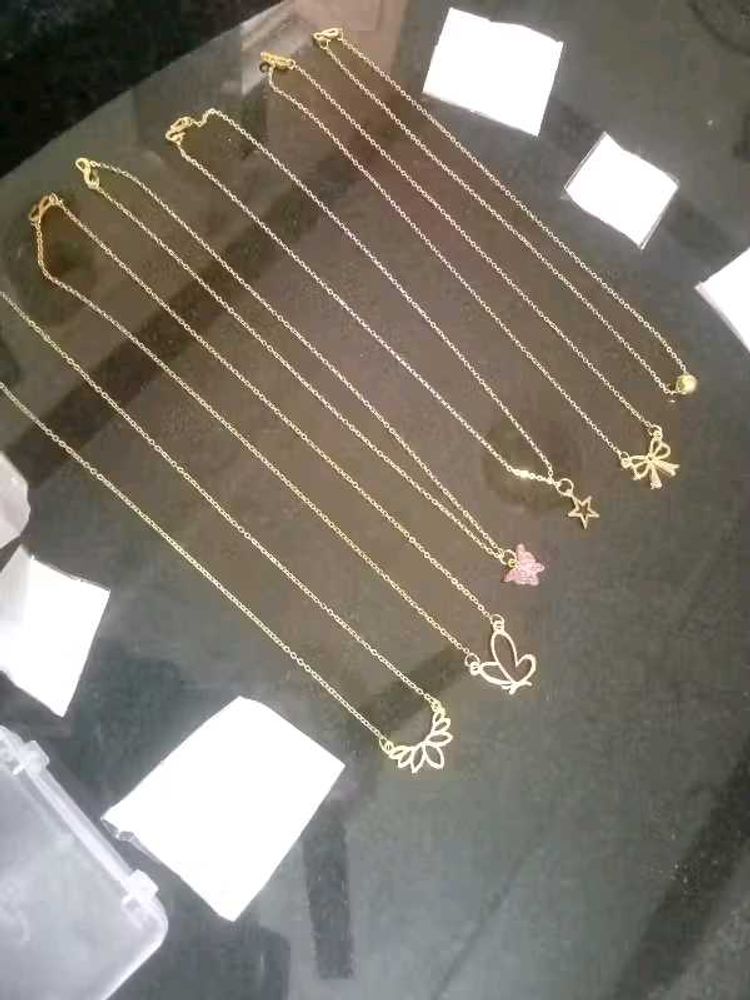 Set of dainty gold necklaces with charms