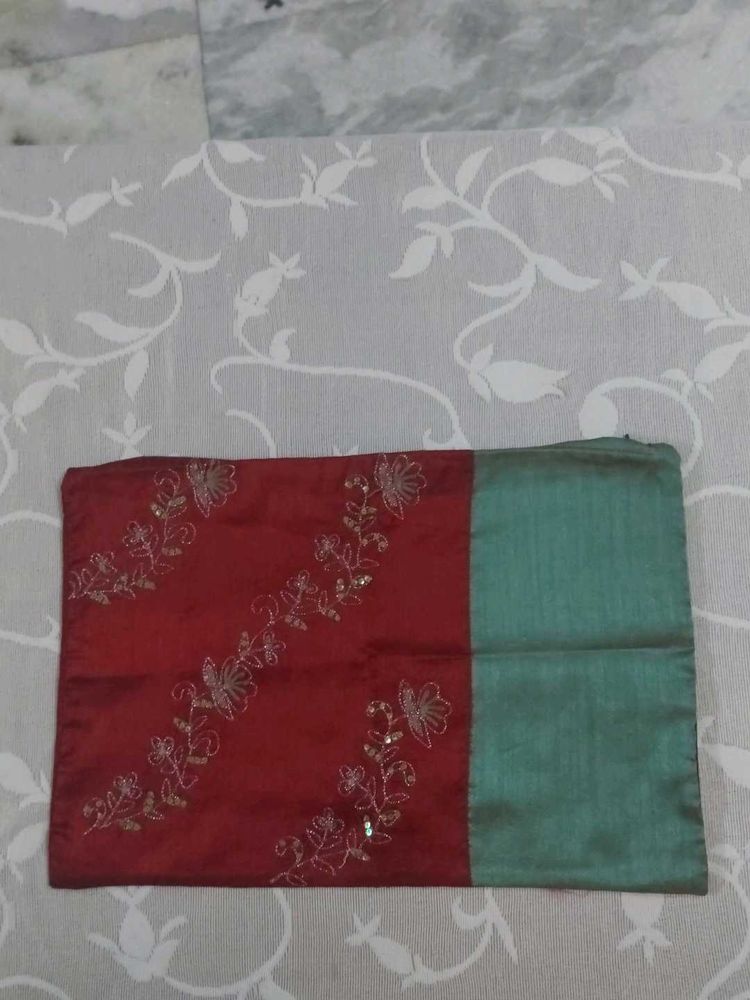 A dual-tone Embroidered Silk Cushion Cover
