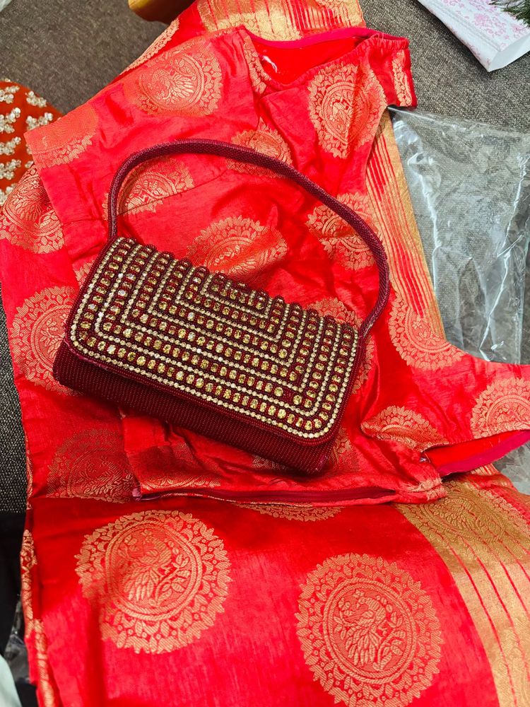 Red Embroidered saree and Blouse with Handbag