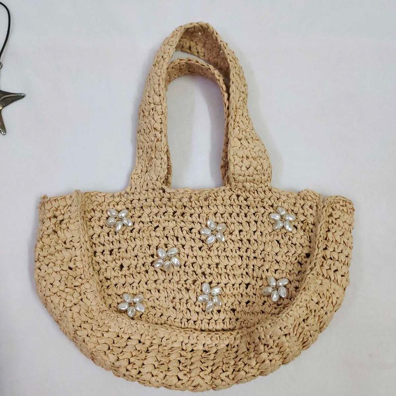 Straw tote bag with pearl embellishments