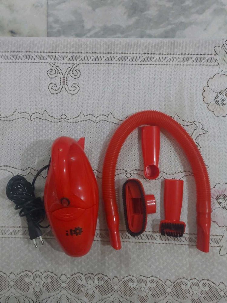 Red hand-held corded electric Vacuum Cleaner