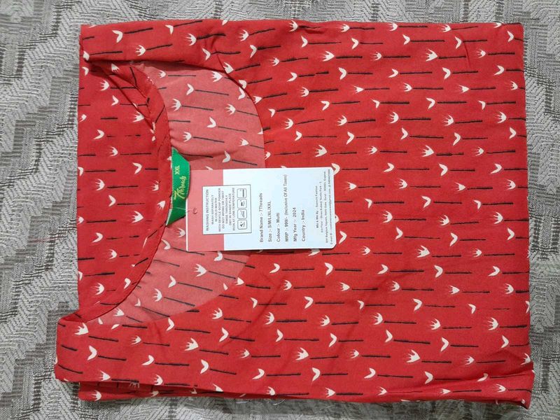 Red printed kurta with matching nail polish