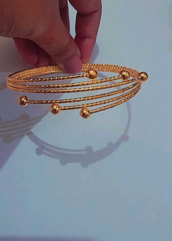 Elegant Gold Tone Coil Bracelet