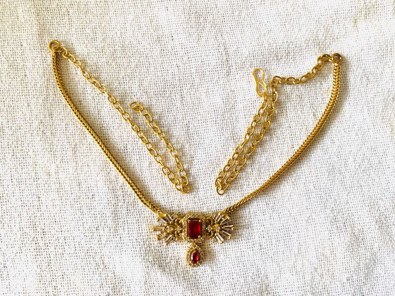 Elegant Gold Necklace with Red Stone