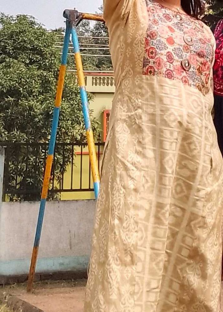 Elegant Cream Kurta with Colorful Neckline