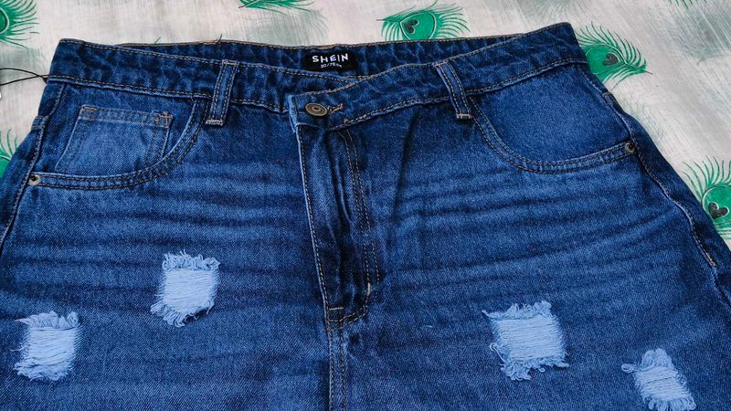 Distressed Blue Denim Jeans