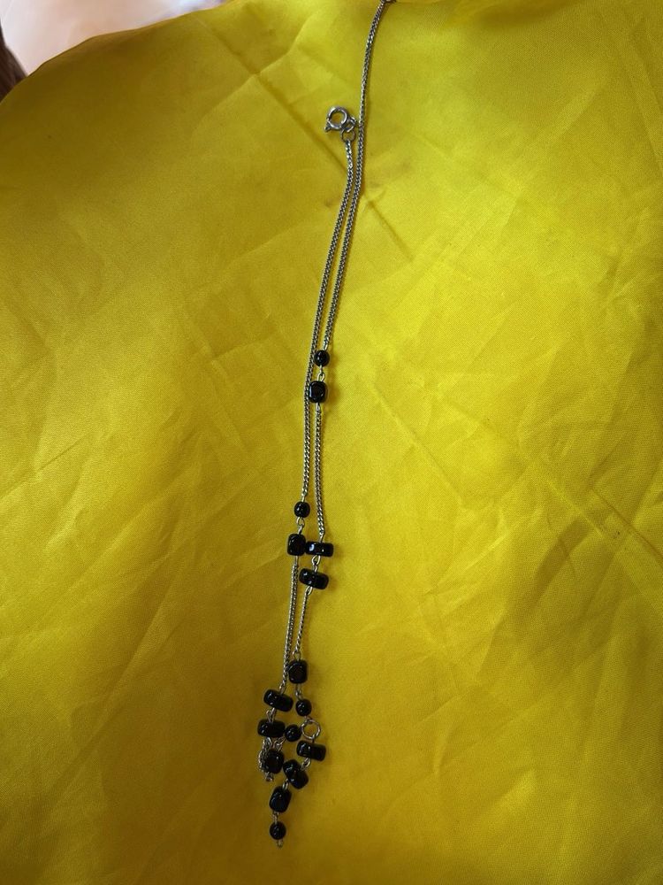 Elegant Silver Necklace with Black Beads