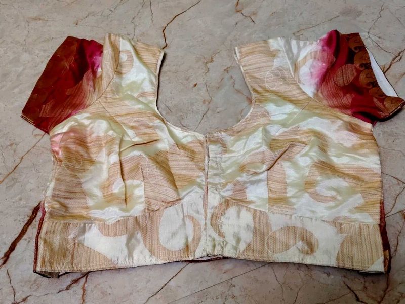 pink border with a cream colour blouse