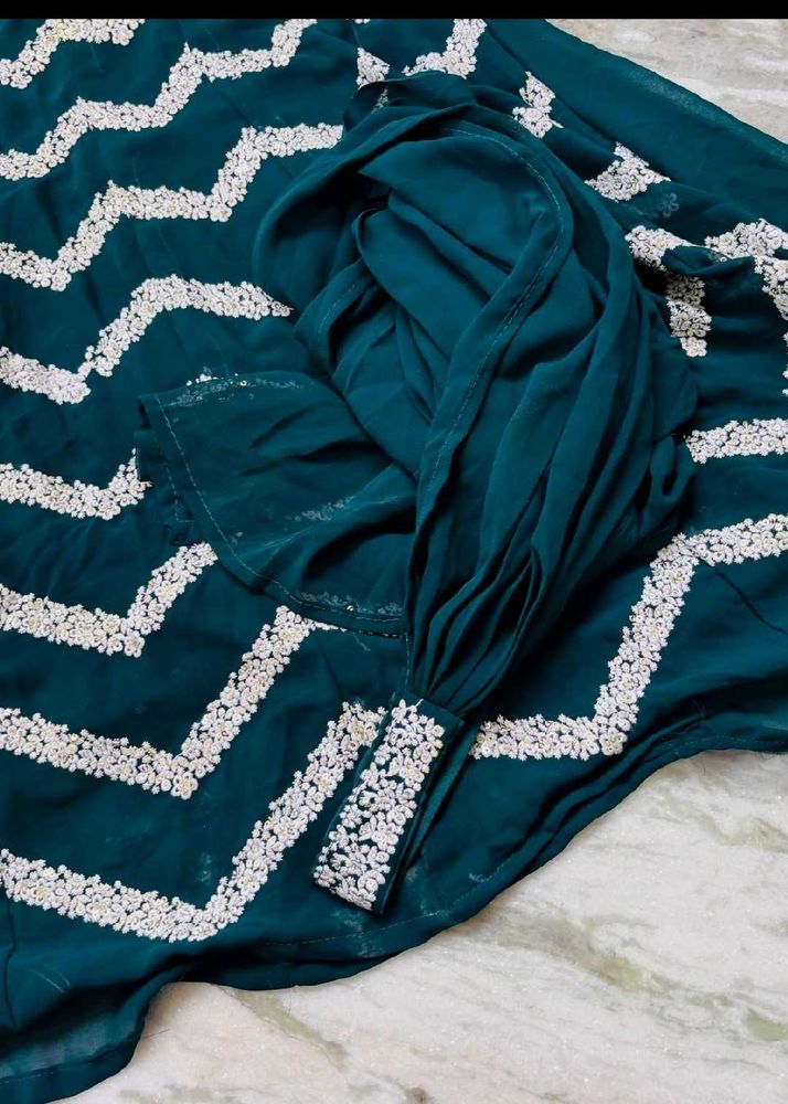 Beautiful Teal Saree with White Embellishments