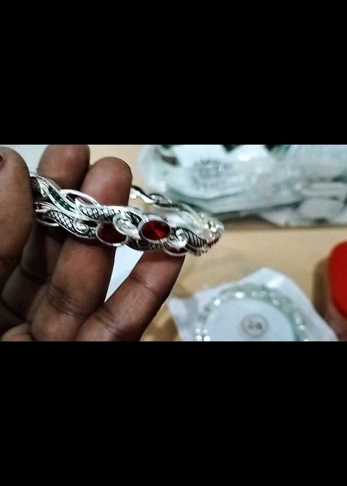 Elegant Silver Bangle with Red Stones