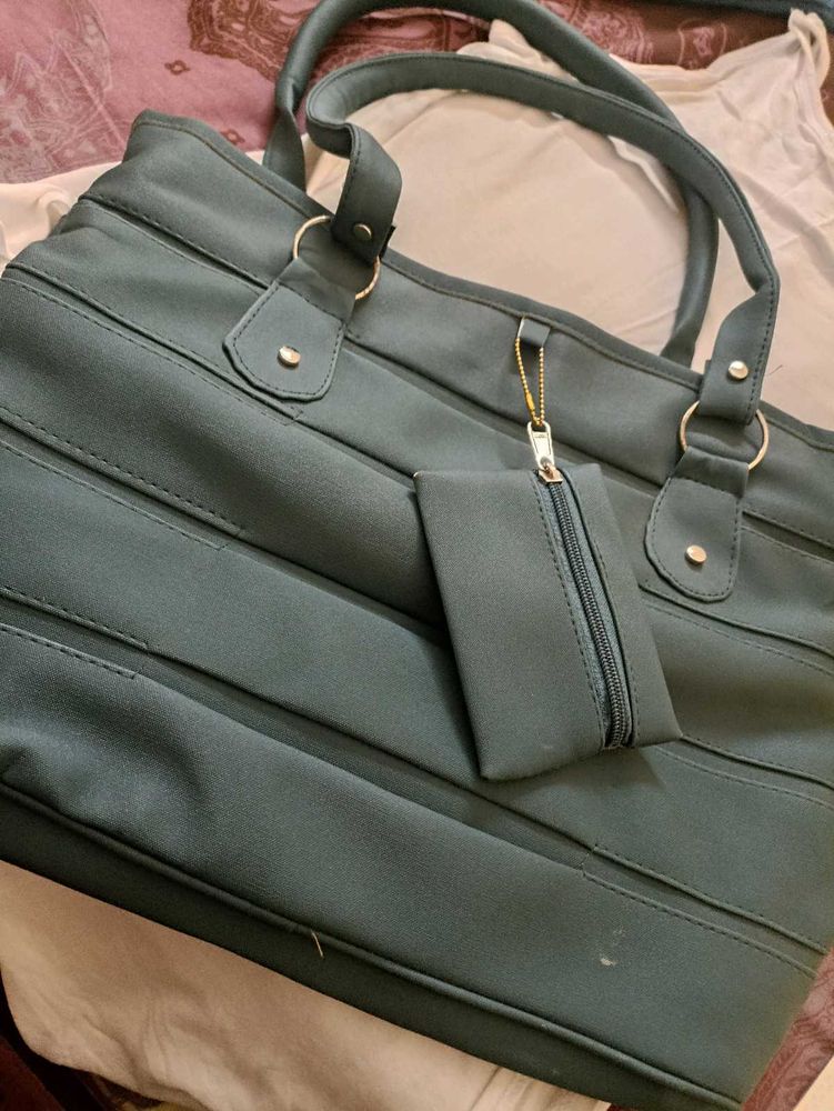 Chic Teal Handbag with Matching Pouch