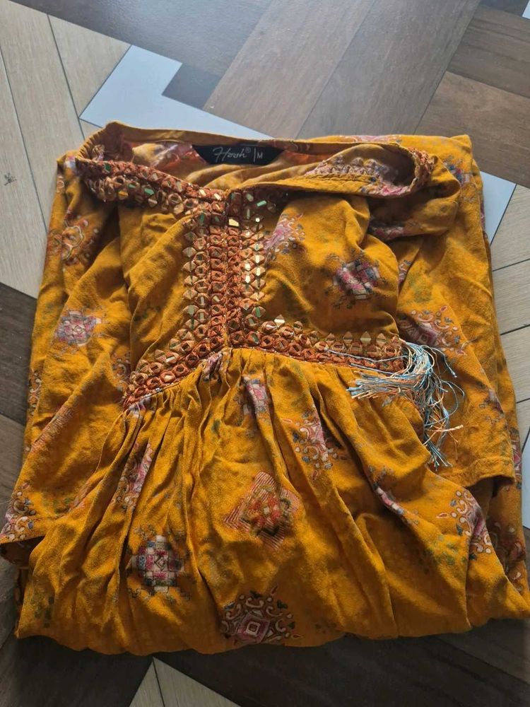 Elegant Yellow Kurta with Intricate Embellishments