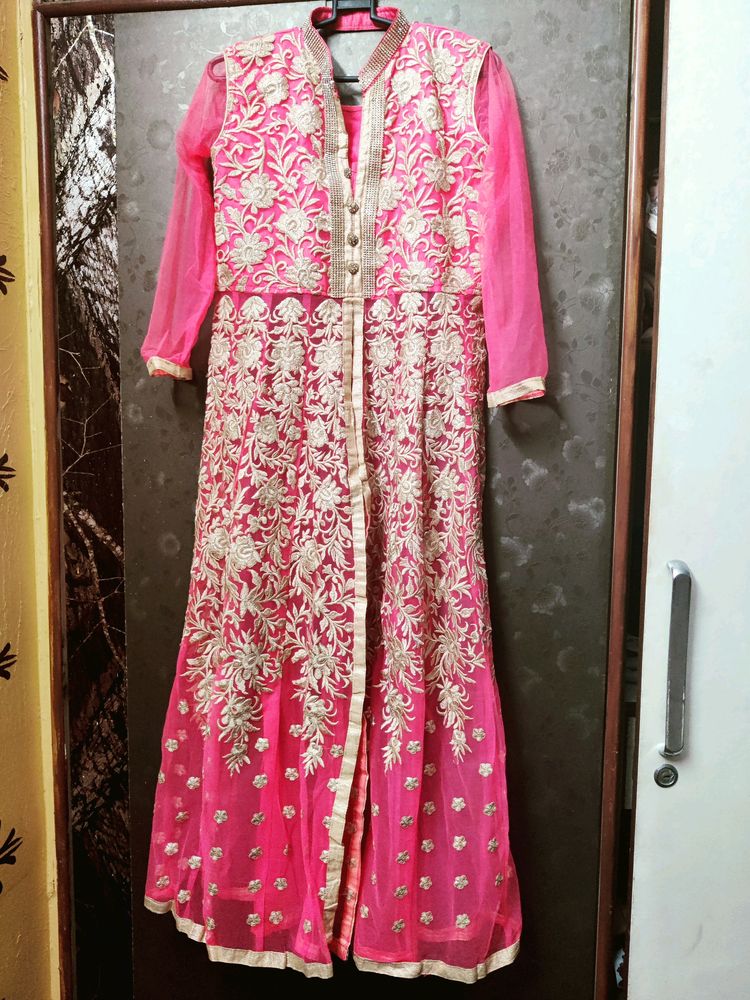 A Beautiful Pinkish Gown With Golden Work