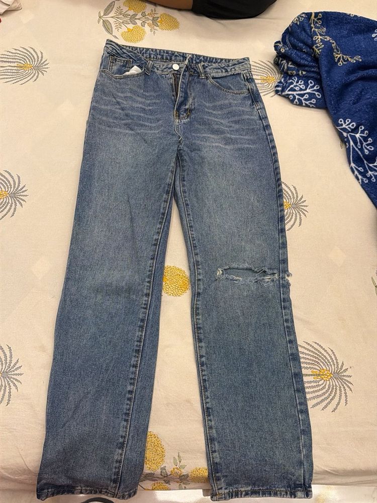 Distressed Blue Denim Jeans
