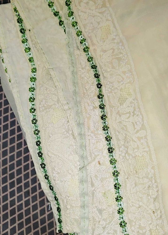 Elegant Cream Saree with Green Embellishments