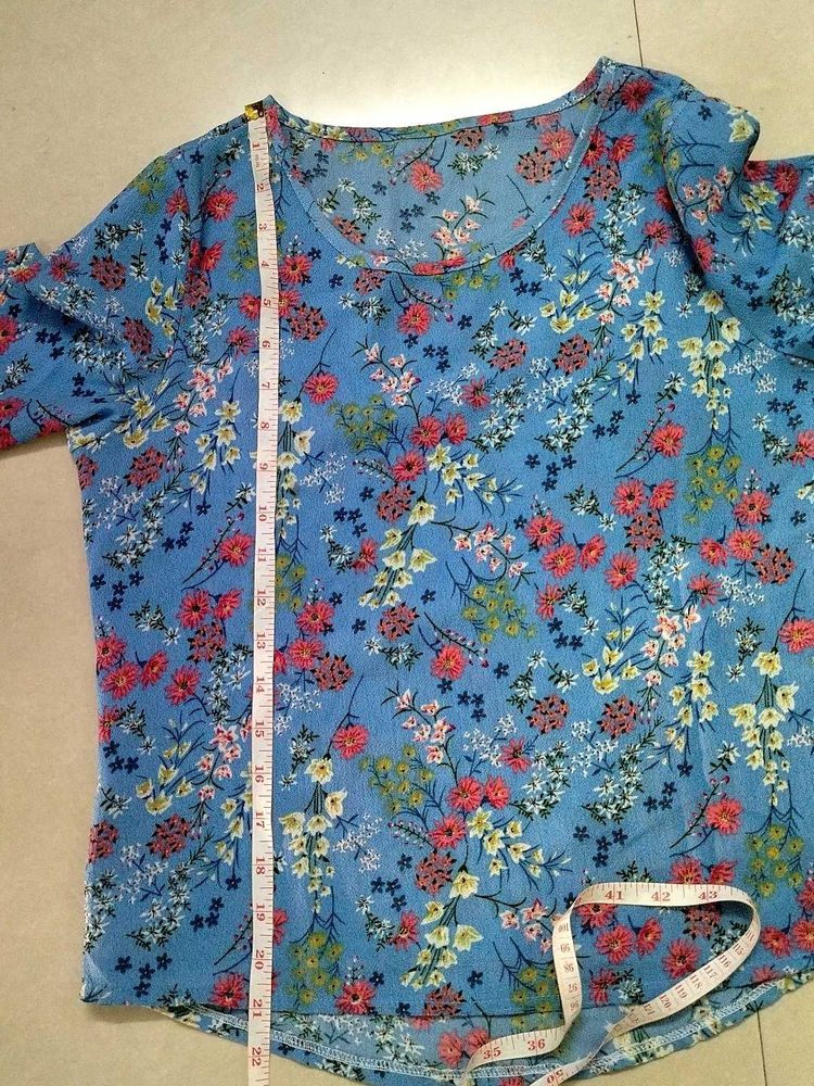 Blue floral ditsy- print top. (Material: Not sure)