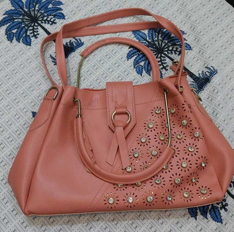 Stylish Peach Handbag with Embellishments