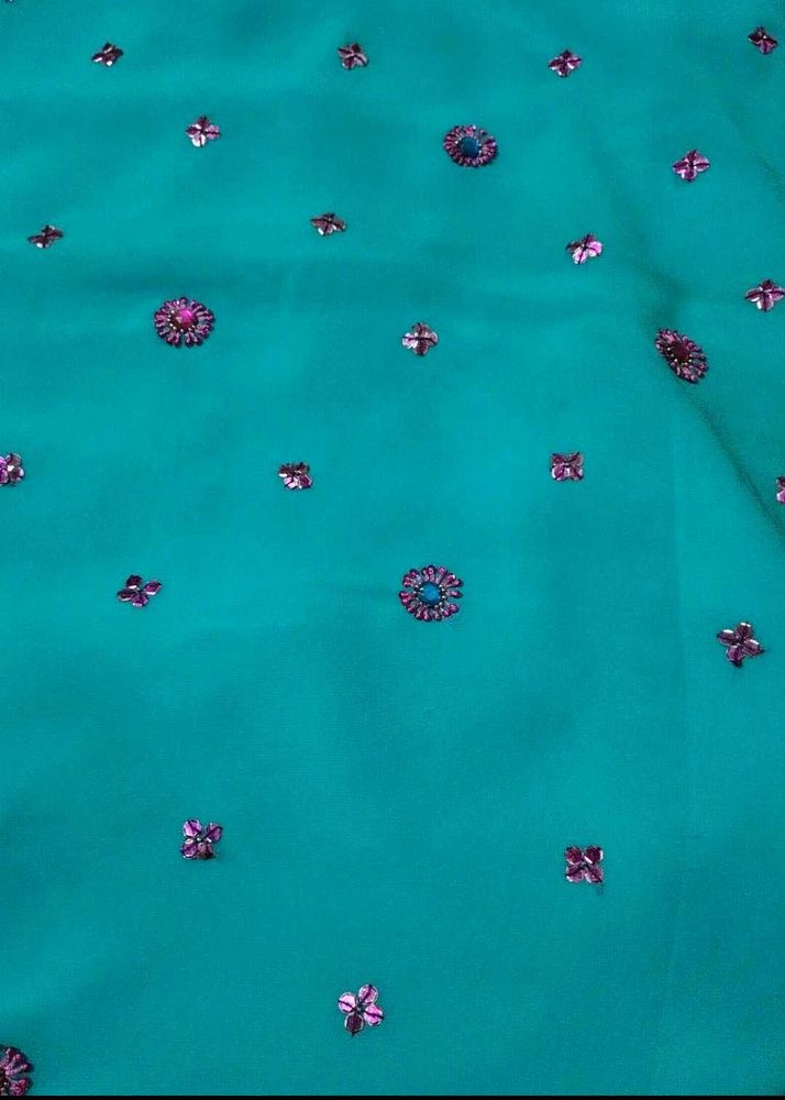Teal Saree with Floral Embellishments