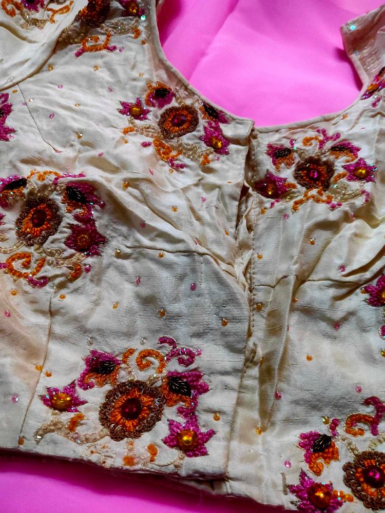 Embroidered silk blouse and plain pink saree