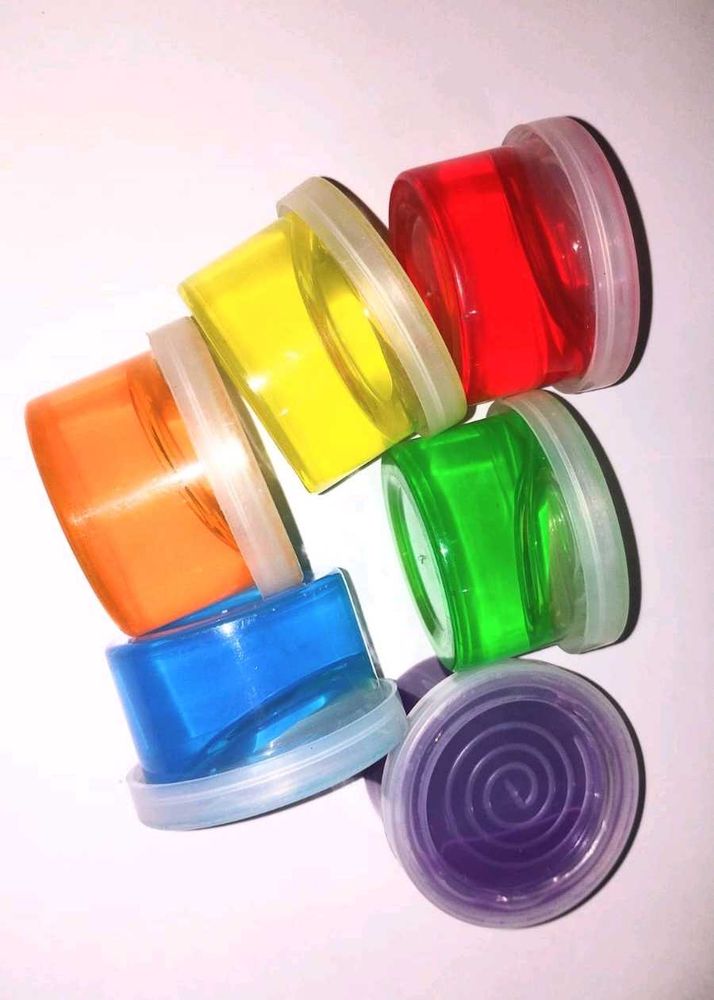 12 containers of colourful slimes