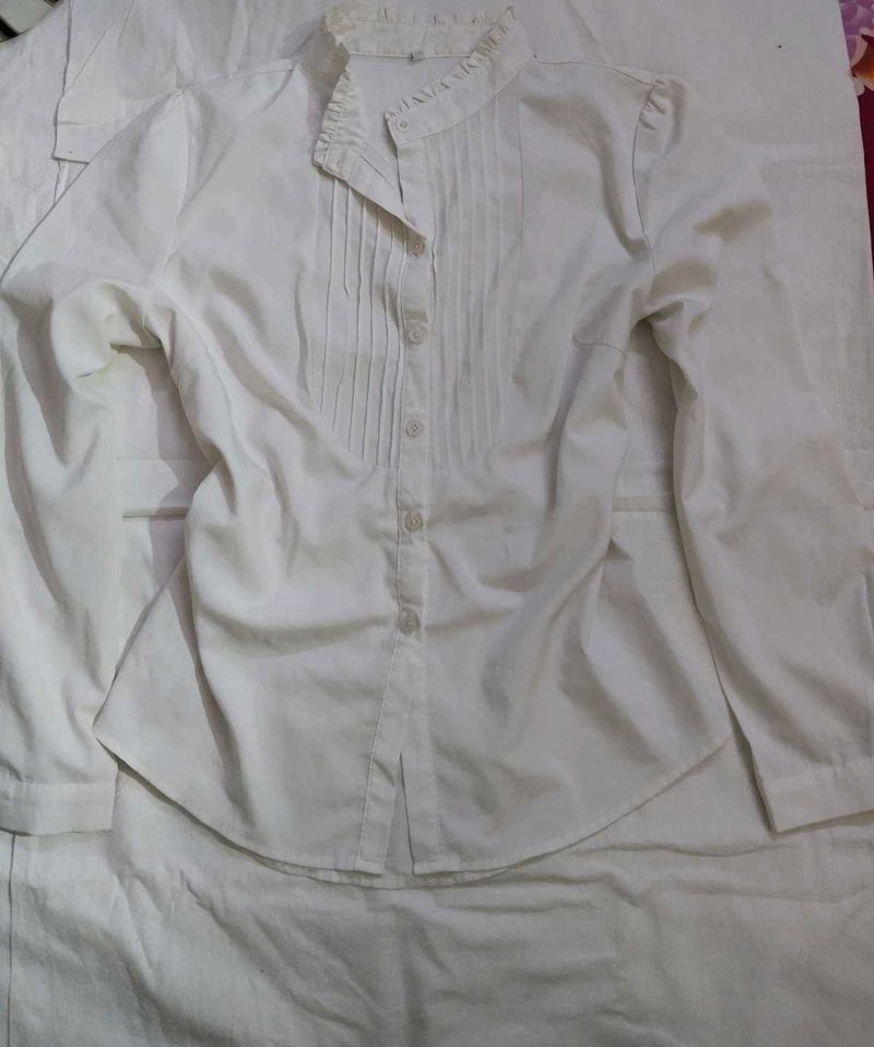 white pleated shirt