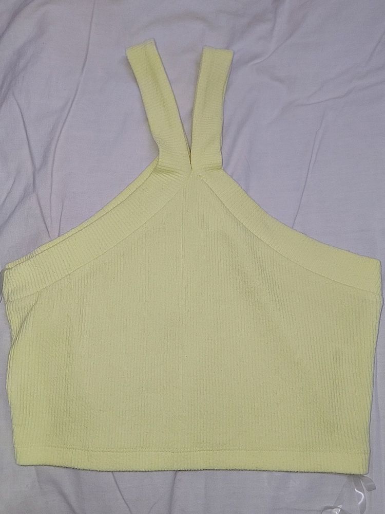 A yellow crop off-shoulder top