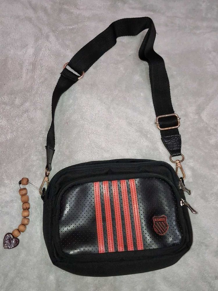 black sling bag with red strip🌸🌸