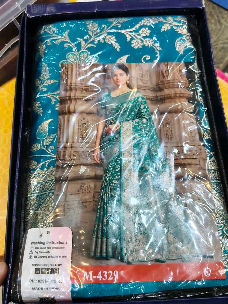 Elegant Teal Saree with Golden Motifs