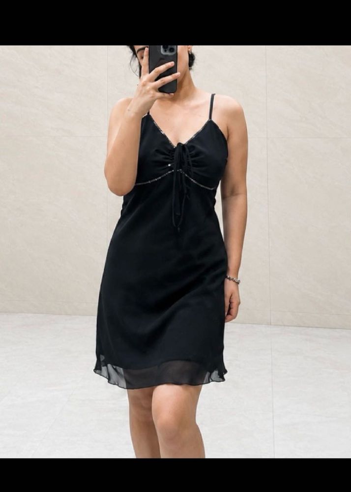 Chic Black Slip Dress with Embellished Neckline