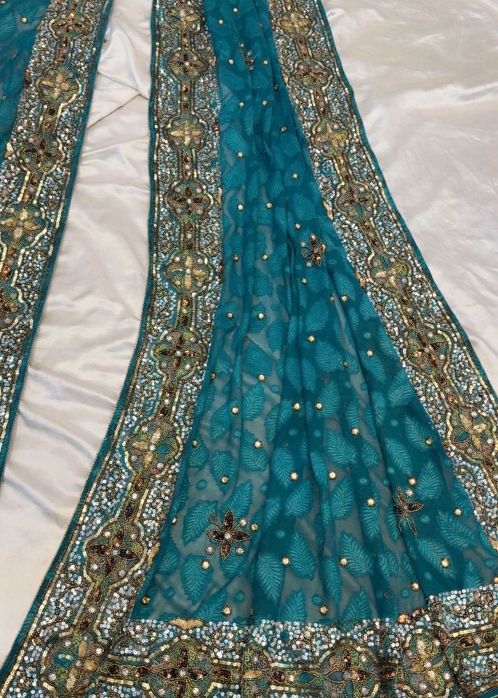 Exquisite Embellished Teal Saree