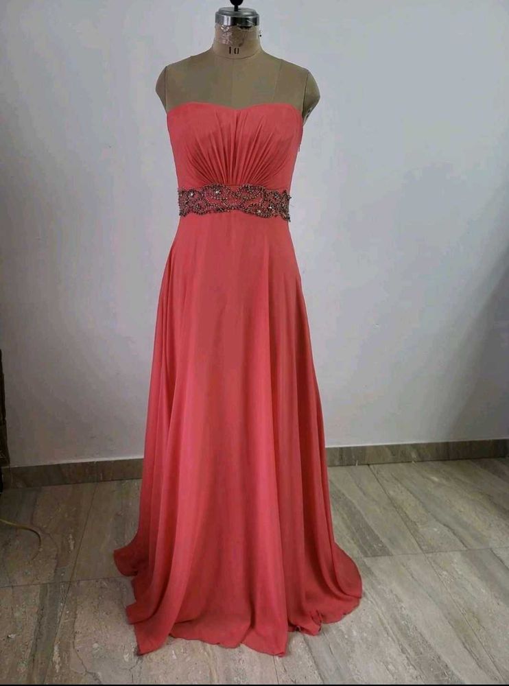 Elegant Strapless Coral Gown with Embellished Wais