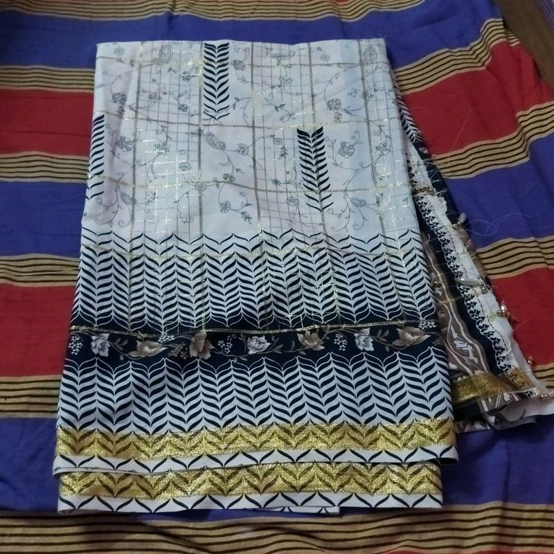 beautiful checked cream saree with black print border