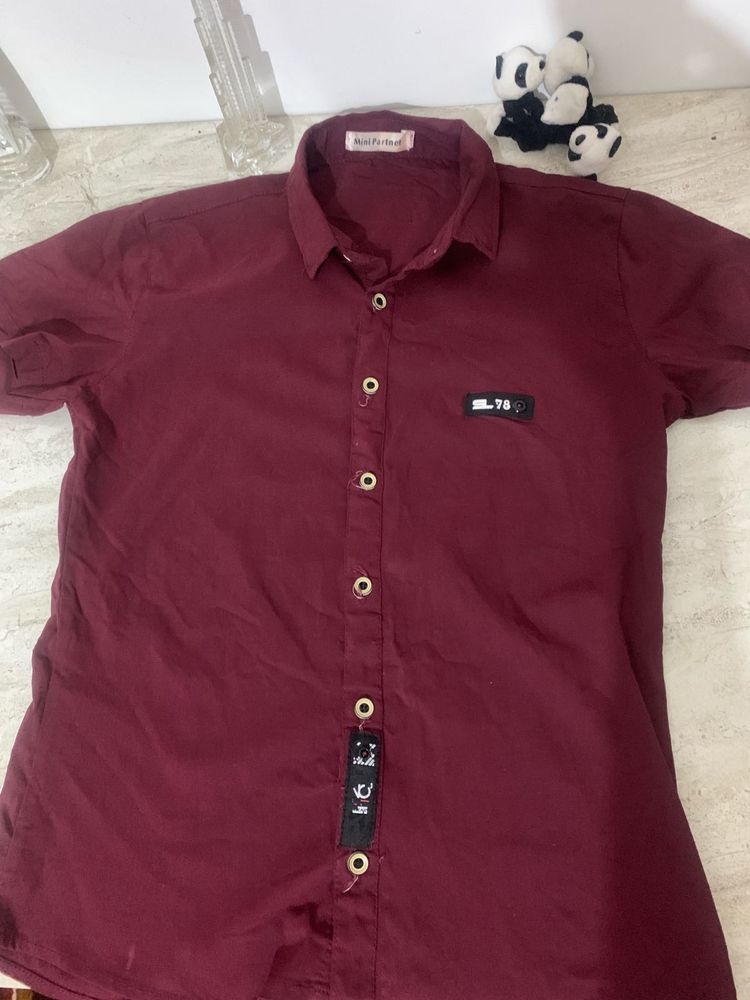 Boys plain maroon half sleeve shirt.