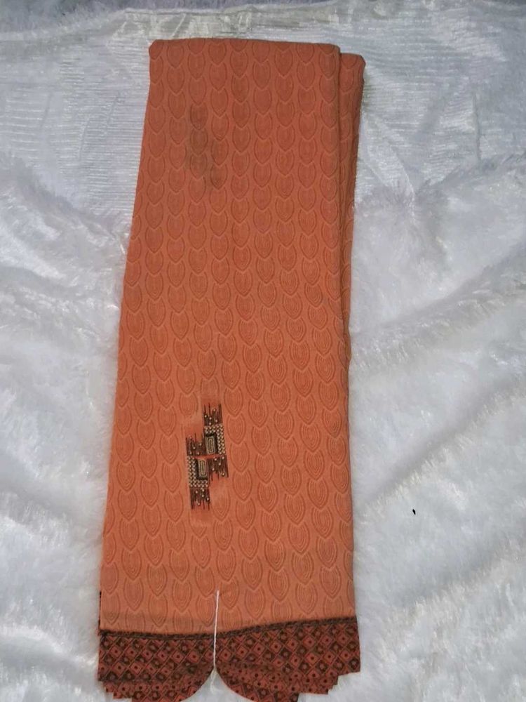 Elegant Orange Saree with Intricate Border without