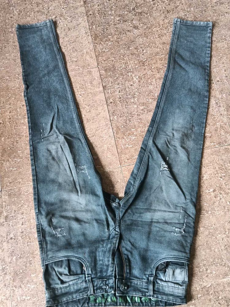 Distressed Blue Denim Jeans