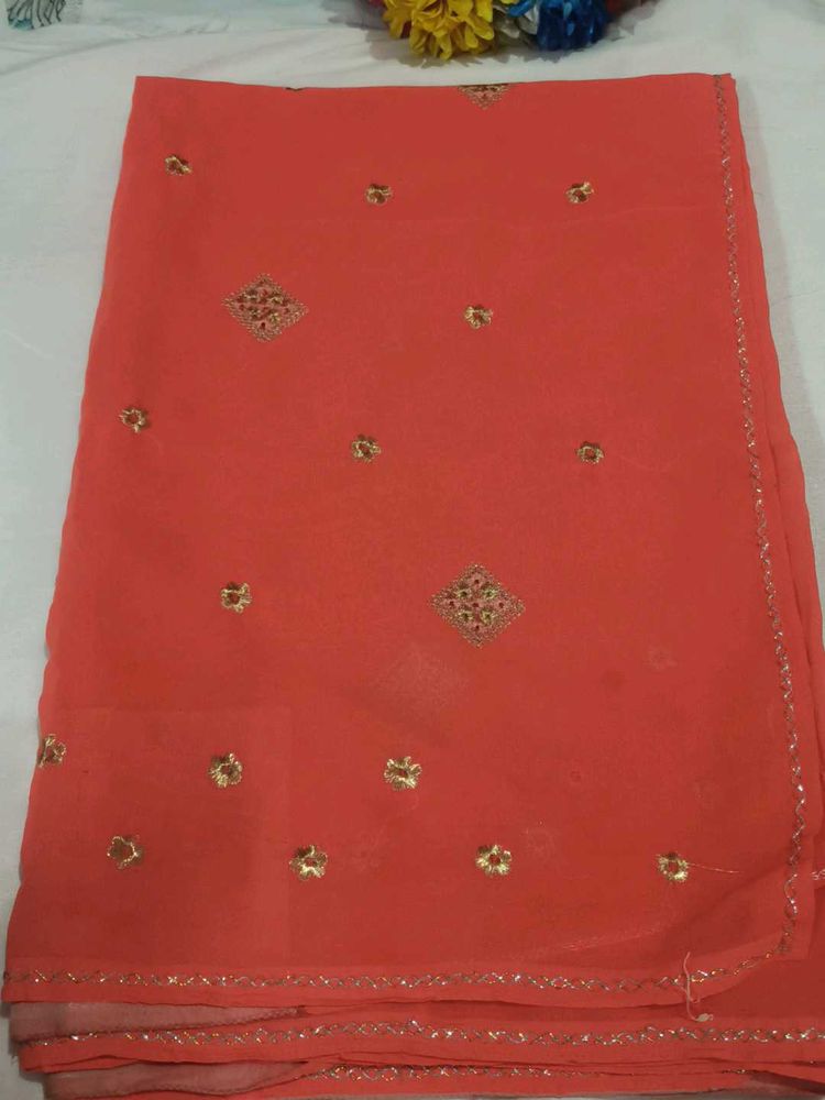 Elegant Orange Saree with Golden Embellishments