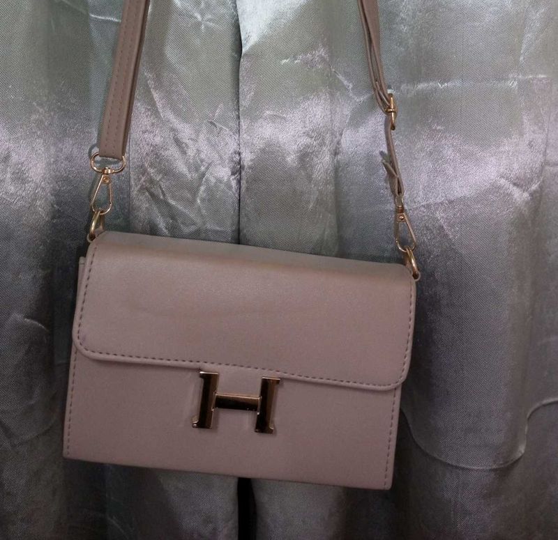Stylish Beige Handbag with “H” Logo