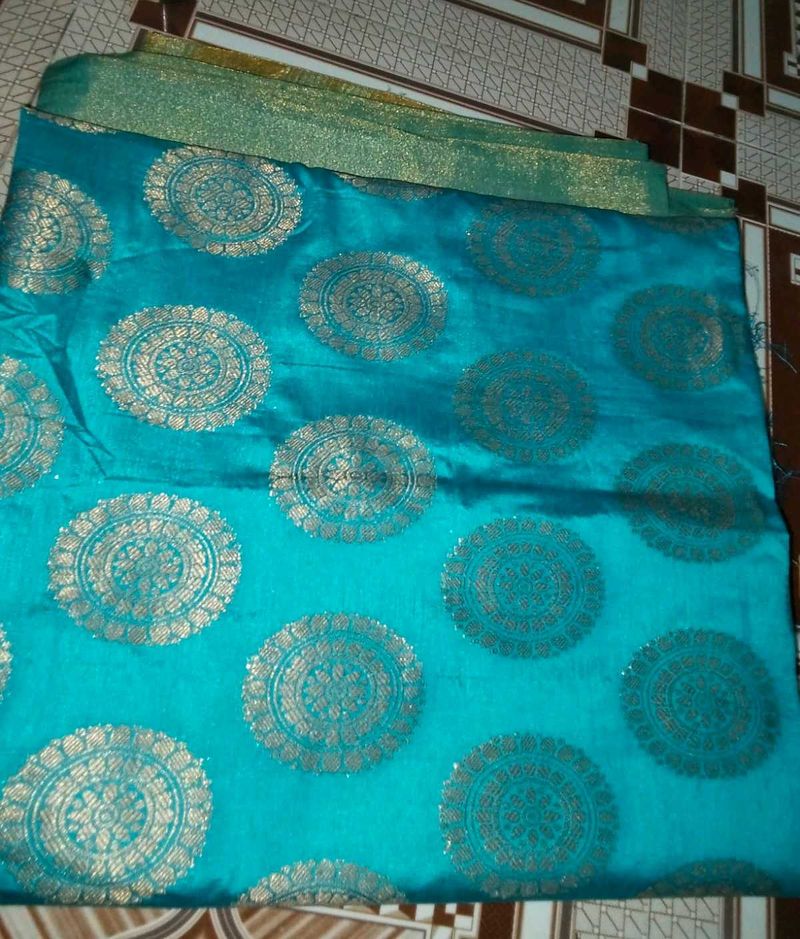 Stunning Teal Saree with Gold Brocade