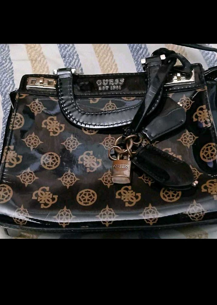 Guess Monogram Sling Bag