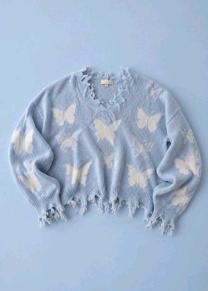 POWDER BLUE BUTTERFLY DISTRESSED CROPPED KNIT SWEA