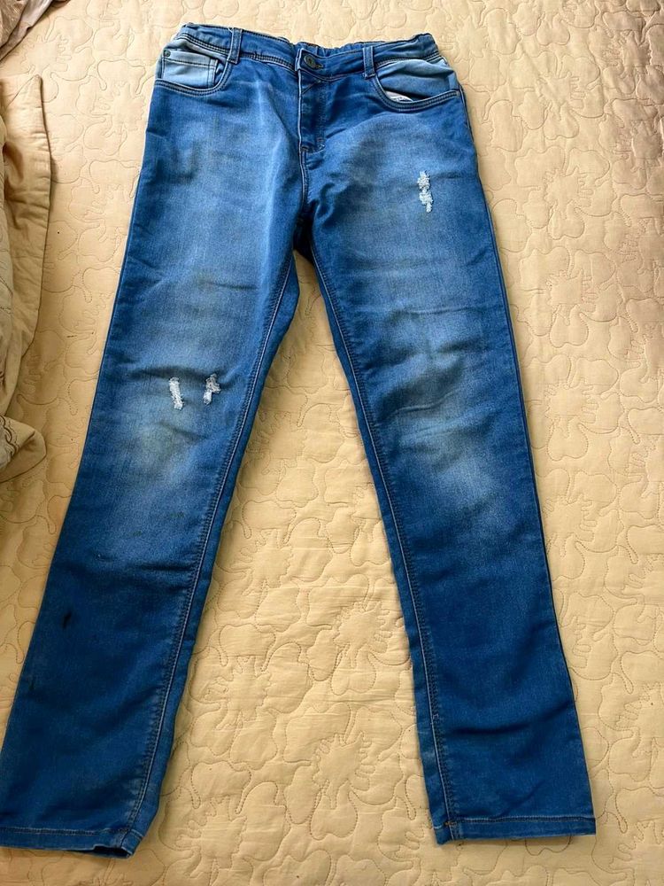 Distressed Blue Denim Jeans