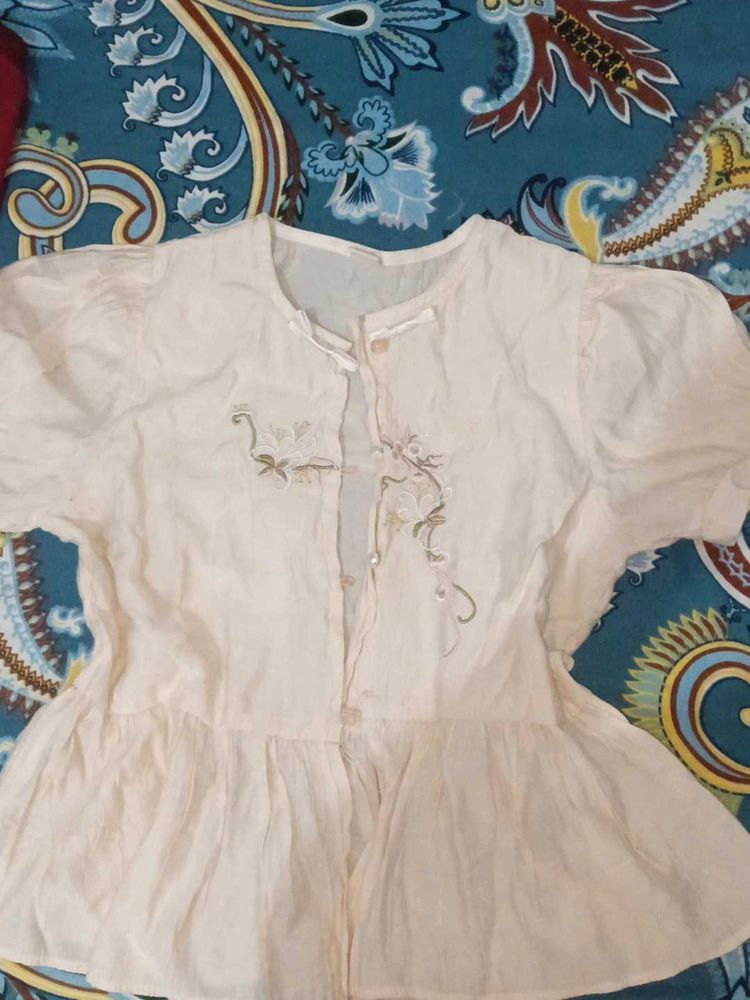 Embroidered peach Peplum top